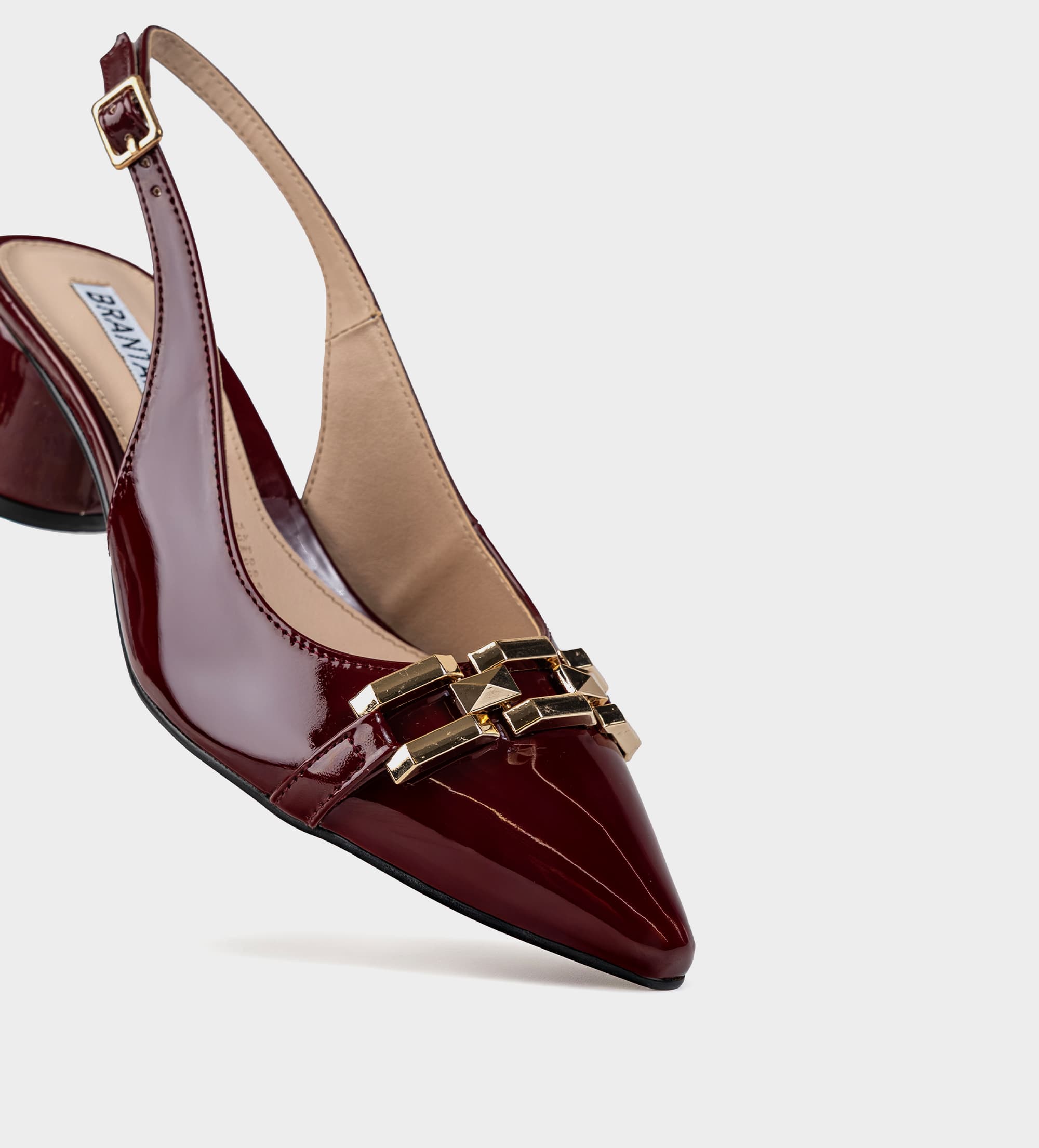 ZAPATILLA DESTALONADA HERRAJE CHAROL VINO
