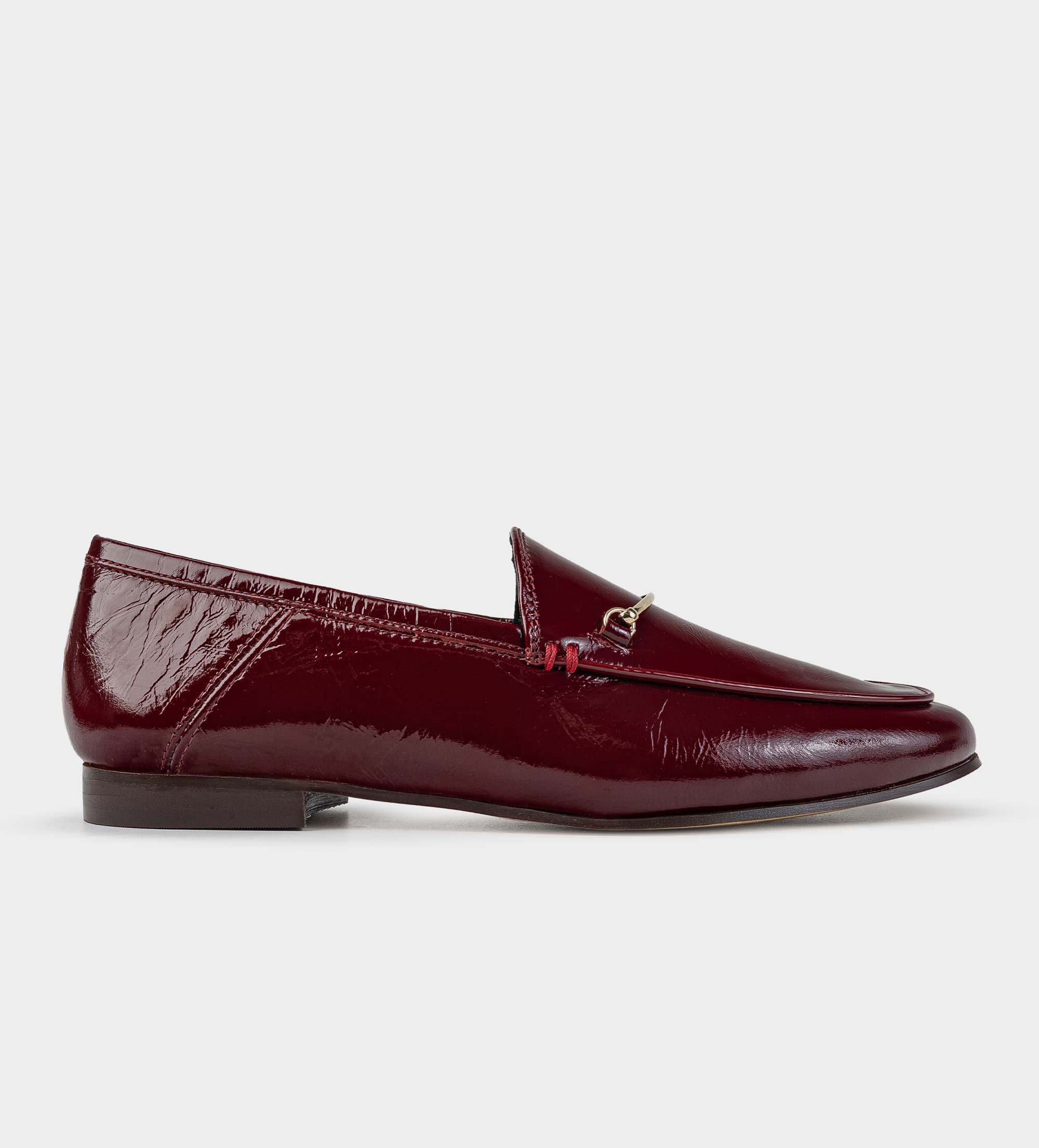 MOCASÍN HERRAJE CHAROL PIEL VINO –