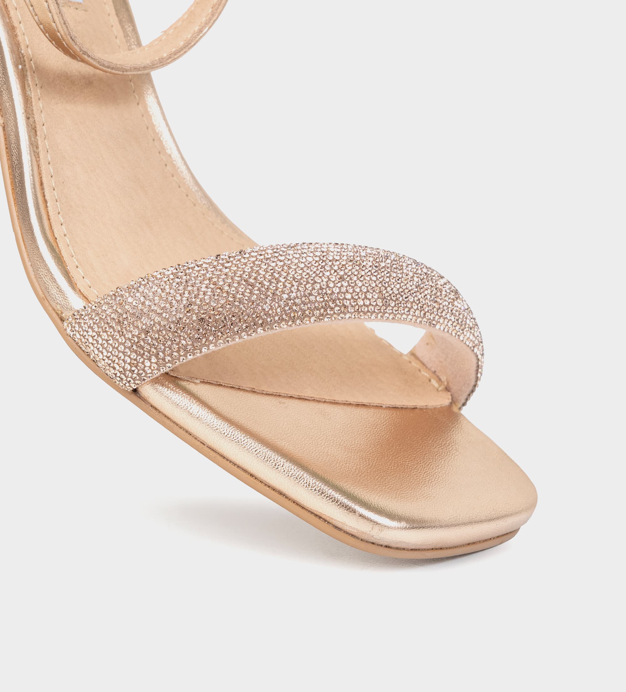 SANDALIA TACÓN TRANSPARENTE BRILLOS ORO ROSA
